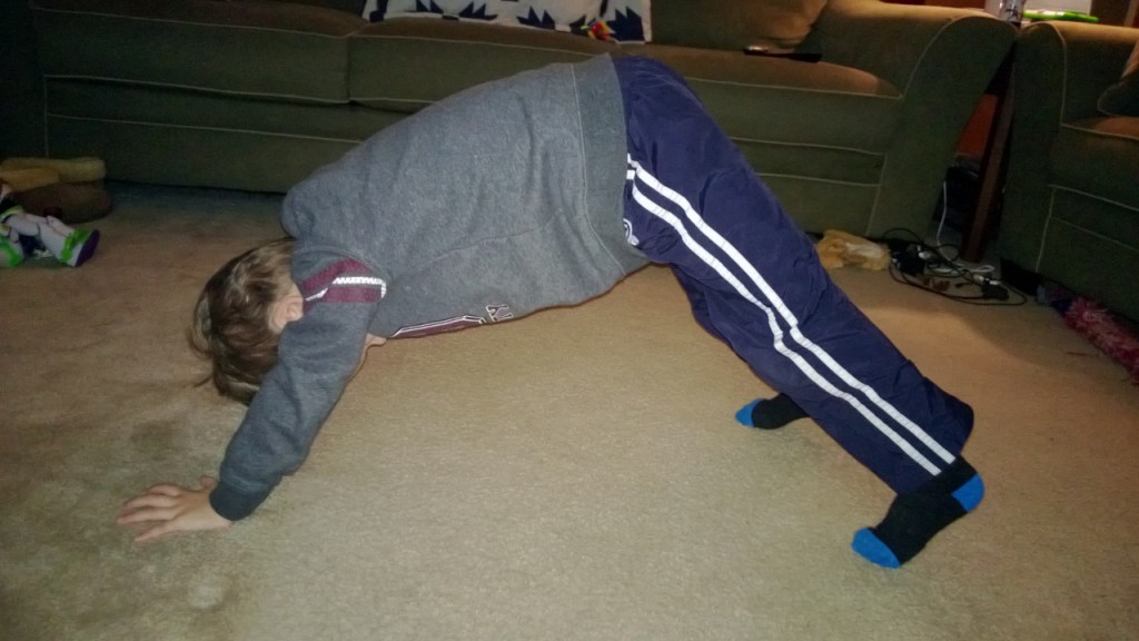 Karsen doing a yoga move during a Jillian Michaels DVD.